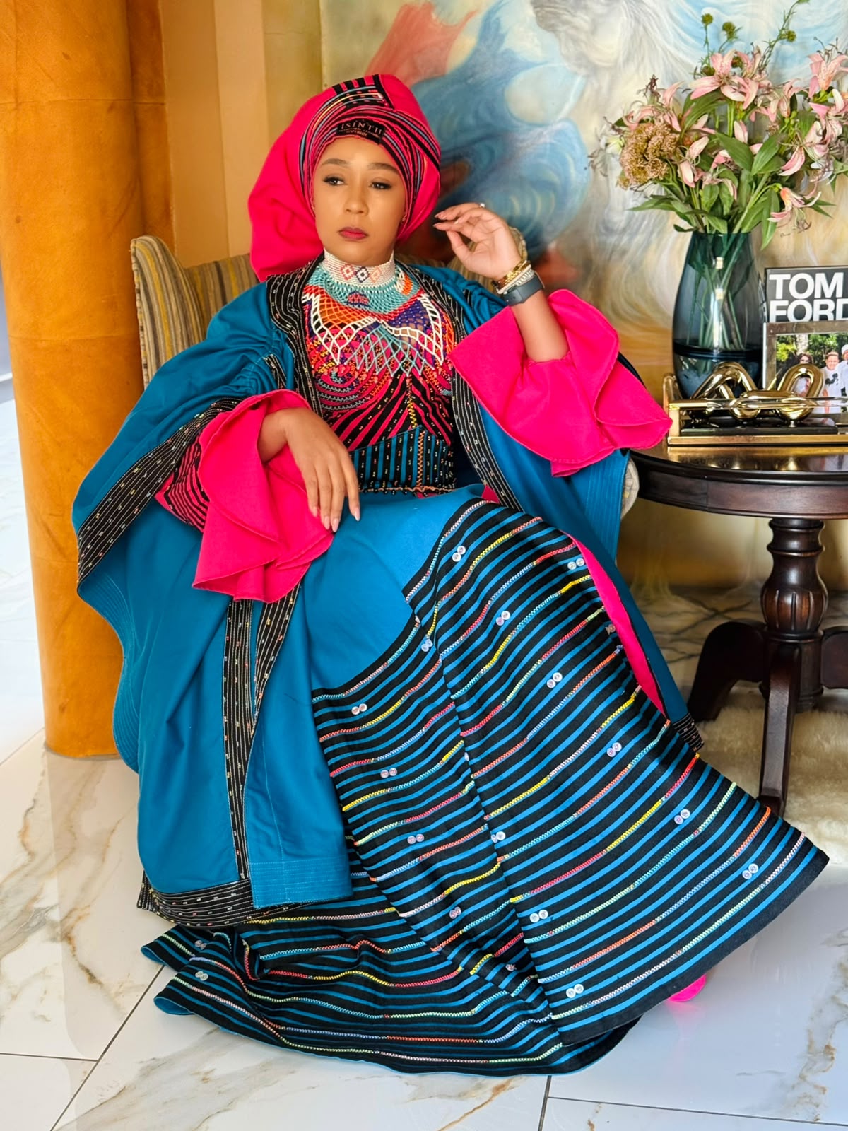 Buli in teal and pink Xhosa attire