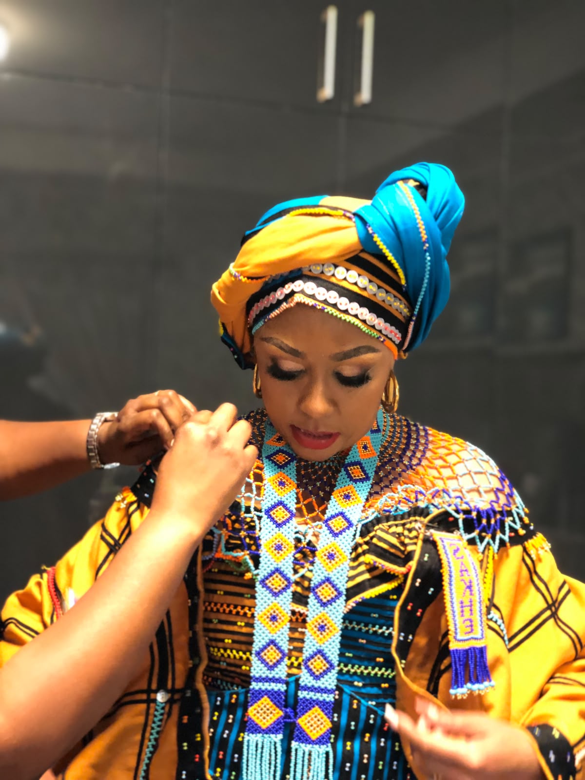 Buli in gold turban and beadwork
